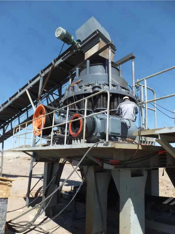 Workers are operating a cone crusher Workers are operating a cone crusher